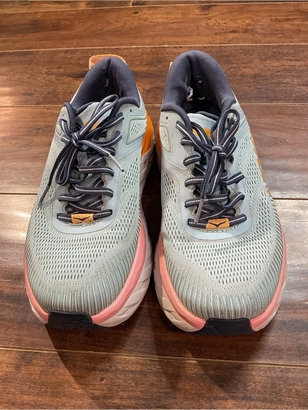 Hoka Blue Athletic Shoes with Orange and Pink Accents